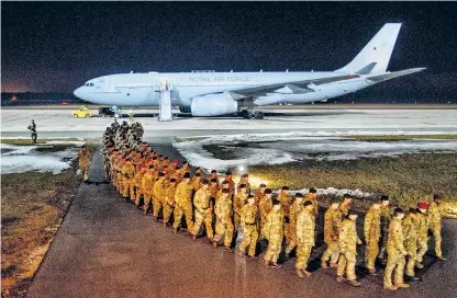  ??  ?? Soldiers from 5th Battalion The Rifles arrive at Amari airbase on Friday. Military equipment, right, destined for Estonia arrives in the port of Emden, Germany