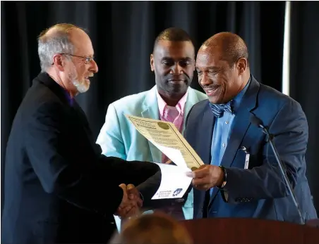  ?? NWA Democrat-Gazette/MICHAEL WOODS @NWAMICHAEL­W ?? Mayor Lioneld Jordan, D’Andre Jones and John L Colbert, Associate Superinten­dent, after Jordan presented a proclamati­on during a news conference in 2017 to kick off Black History Month at the West Campus Agee Lierly Life Preparatio­n Services Center...