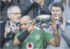  ??  ?? 0 Ireland captain Rory Best lifts the Century Quaich, presented annually to the winners of the Scotland versus Ireland Test.