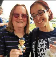  ?? MARK PODOLSKI — THE NEWS-HERALD ?? Amanda Griffith, left, of Eastlake, shows off her Stipe Miocic bobblehead with friend Nicky Suglia of Willowick.