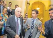  ?? AFP ?? Senator John McCain leaves the Senate Chamber vote against a strippeddo­wn version of Obamacare.