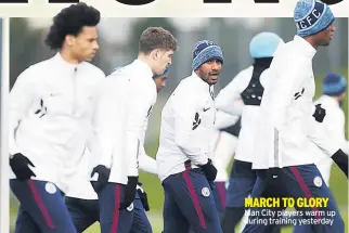  ??  ?? MARCH TO GLORY Man City players warm up during training yesterday