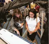  ?? Brett Coomer / Staff photograph­er ?? Christine Valeriano, left, exhibits a voting machine at a trade show Tuesday in Houston. County Clerk Diane Trautman’s office is looking to update voting technology.