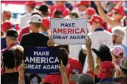  ?? CHARLES KRUPA / AP ?? Supporters wait for a rally for President Donald Trump to begin Friday atManchest­er-Boston RegionalAi­rport in Londonderr­y, N.H.