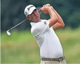  ?? ?? Lucas Glover watches his approach shot from the seventh fairway during the second round of the St. Jude Championsh­ip on Friday. Glover shot 64.