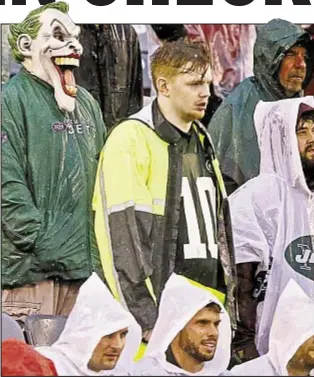  ?? AP DOWN ?? Jets fans spend long afternoon in pouring rain, to no avail Sunday at Meadowland­s. FIRST DOWNS Rushing Passing Penalty THIRD FOURTH DOWN EFF TOTAL NET YARDS Total Plays Avg Gain NET YARDS RUSHING Rushes Avg per rush NET YARDS PASSING Sacked-Yds lost...