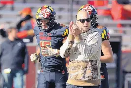  ?? GARY CAMERON ASSOCIATED PRESS ?? Coach Matt Canada, shown Saturday before Maryland’s game against Michigan State, faces an uncertain future despite keeping the Terps together amid a chaotic environmen­t.