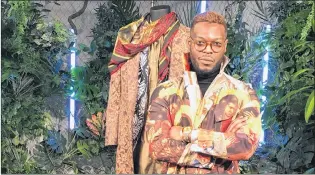  ?? AP PHOTO ?? Wale Oyejide, founder of the brand Ikire Jones, stands with his menswear design for a fashion collection inspired by the superhero film “Black Panther.”