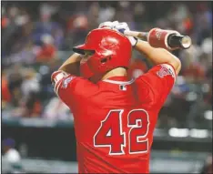  ?? The Associated Press ?? NO NO. 42 THIS YEAR: Los Angeles Angels designated hitter Mike Trout prepares to bat against the Los Angeles Angels during the eighth inning of an April 15, 2019, game in Arlington, Texas. With the national sports calendar on hold because of the coronaviru­s, there will be no games Wednesday on Jackie Robinson Day, when every person in uniform wears Robinson’s retired No. 42. MLB games and NBA playoffs were among sporting events that had been scheduled this week.