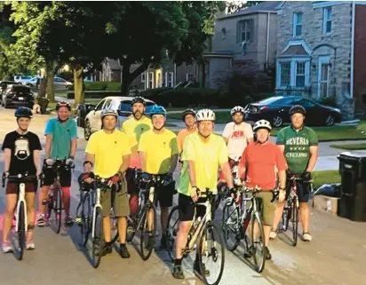  ?? PAT MAC’S PACK Pedaling Pack 100K ?? A group of bike riders led by Sean Flood, front, gets ready for a 15-mile ride before 5 a.m. Tuesday morning to prepare for the Pat’s ride.