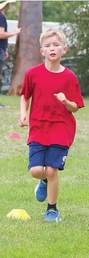  ?? ?? Warragul Primary School student Jace Radford puts in a great effort in the cross country race.