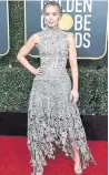  ??  ?? Mary Poppins herself, a.k.a. the enchanting Emily Blunt, in a striking Alexander McQueen design.