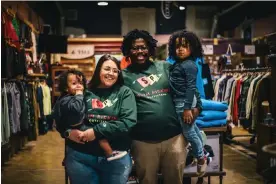  ?? ?? Jahmicah Dawes, right, his wife, Heather, and their children inside Slim Pickins Outfitters. Photograph: Tommy Corey