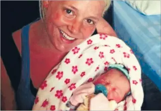  ??  ?? Together again: Melissa McMahon and daughter Victoria were reunited after police rescued the baby from a house northwest of Montreal. ‘‘The helplessne­ss was difficult to accept,’’ said McMahon of her ordeal.