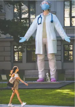  ?? GINTS IVUSKANS / AFP VIA GETTY IMAGES ?? A statue of a doctor stands outside the National Museum of Arts in Riga, Latvia. A new study finds lower mortality
rates among patients treated by female physicians.