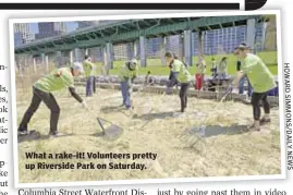  ??  ?? What a rake-it! Volunteers pretty up Riverside Park on Saturday.