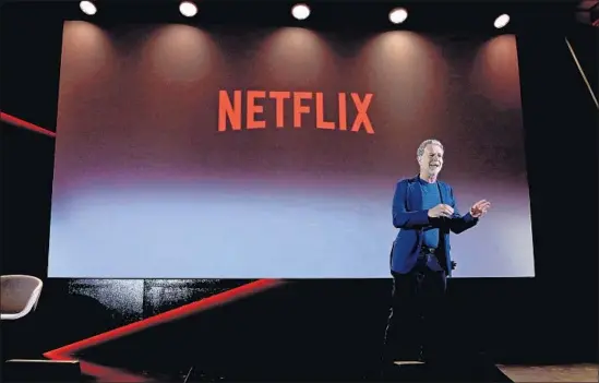  ?? Ernesto S. Ruscio Getty Images ?? REED HASTINGS has turned Netflix into a streaming-video force. By licensing their old hits to Hastings, media firms have received payouts but at considerab­le cost.