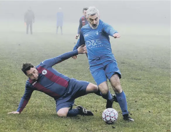  ?? ?? Sunderland Hall Farm O40s (navy/red) in action against Mill View SC last Saturday.