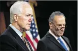  ?? DREW ANGERER / GETTY IMAGES ?? Sen. John Cornyn, R-Texas (left), and Sen. Chuck Schumer, D-N.Y., showed rare bipartisan unity in voting to override the veto of the 9/11 victims bill.