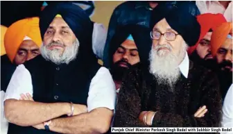  ??  ?? Punjab Chief Minister Parkash Singh Badal with Sukhbir Singh Badal