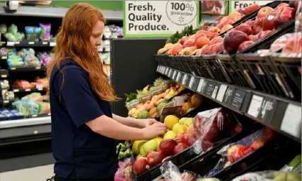  ?? Post-Gazette ?? A worker at Walmart in North Versailles in 2016. Walmart is starting home delivery service Thursday.