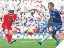  ??  ?? Liverpool’s Philippe Coutinho scores his side’s second as they beat Chelsea 3-1 last year to hasten Jose Mourinho’s departure.