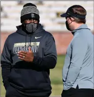  ?? (AP/L.G. Patterson) ?? Derek Mason (left), shown talking with Missouri Coach Eli Drinkwitz before Saturday’s game in Columbia, Mo., was fired as Vanderbilt’s coach Sunday. The Commodores are 0- 8 after Saturday’s 41-0 loss to Missouri.