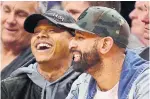  ?? FRANK GUNN THE CANADIAN PRESS ?? One day after the Blue Jays filled their managerial vacancy, Marcus Stroman and ex-Jay all-star Jose Bautista filled courtside seats.