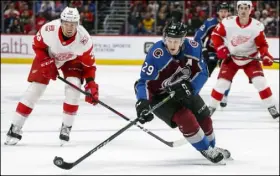  ?? Jack Dempsey The Associated Press ?? Colorado center Nathan MacKinnon (29), skating against Detroit on March 18, is having a stellar offensive season and is a candidate for the Hart Trophy as the NHL’s most valuable player.