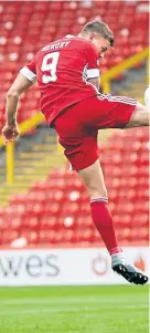  ??  ?? Dons striker Callum Hendry