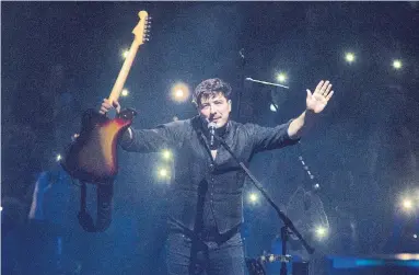  ?? OWEN SWEENEY INVISION/THE ASSOCIATED PRESS ?? Marcus Mumford and his band, Mumford &amp; Sons, performed to a sold-out, boisterous crowd Monday at Scotiabank Arena.