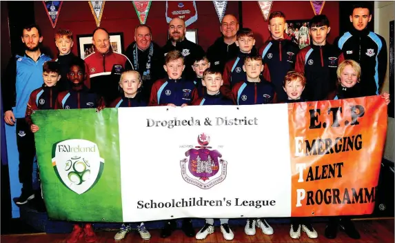  ??  ?? Members of the Drogheda Children’s League’s ETP Programme with Drogheda United players and officials at the launch of the Player Pathway scheme.