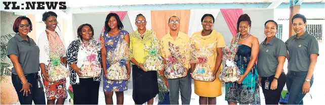  ??  ?? Members of the Jamaica Broilers Group’s public relations team pose with the teachers from McCook’s Primary School after presenting them with gift baskets as part of the JBG’s new Teachers’ Day initiative.