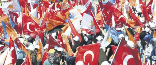  ??  ?? People wave AK Party banners and flags during the party’s rally in the capital city of Ankara ahead of the June 24 presidenti­al and parliament­ary elections, June 9.