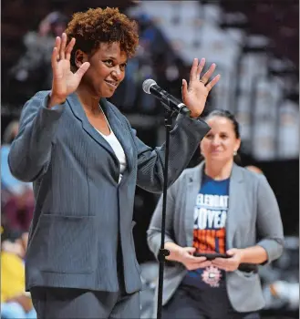  ?? SEAN D. ELLIOT/THE DAY ?? Former Connecticu­t Sun star Asjha Jones acknowledg­es the fans as she is honored on the court following the Sun game against the Los Angeles Sparks on Saturday at Mohegan Sun Arena.