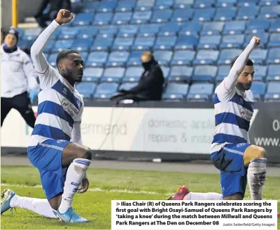  ?? Justin Setterfiel­d/Getty Images) ?? Ilias Chair (R) of Queens Park Rangers celebrates scoring the first goal with Bright Osayi-Samuel of Queens Park Rangers by ‘taking a knee’ during the match between Millwall and Queens Park Rangers at The Den on December 08