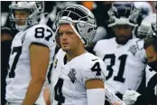  ?? STEVEN SENNE — THE ASSOCIATED PRESS, FILE ?? Raiders quarterbac­k Derek Carr watches from the sideline in the second half against the Patriots on Sept. 27 in Foxborough, Mass.