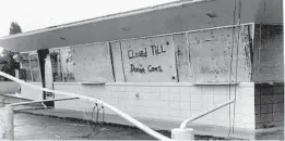  ?? ?? After Hurricane Donna hit Central Florida on Sept. 10 and 11, 1960, a sign on a boarded-up business reads “Closed Till Donna Goes.”