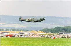  ?? ?? Left, a spitfire ‘shoots down’ a Messerschm­idt 108 over the airfield boundary in August 1985. Centre, a two-seater spitfire at the show in 1991. Right, airshow organiser Elly Sallingboe