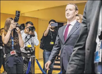  ?? Geert Vanden Wijngaert The Associated Press file ?? Facebook CEO Mark Zuckerberg leaves the EU Parliament in Brussels in May 2018. A European Federal Cartel Office ruling in February made it harder for Facebook to combine data from all its services.