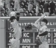  ?? [RICHARD CARSON/THE ASSOCIATED PRESS] ?? Indians shortstop Francisco Lindor, left, leaps for a high-five with center fielder Bradley Zimmer after their third straight victory over the Astros. Cleveland finished the season series 5-1 against Houston.