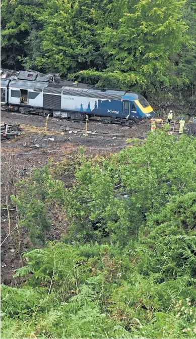  ??  ?? TRAGEDY: The scene of the derailment at Carmont, near Stonehaven, top and left, in which Brett Mccullough, Christophe­r Stuchbury and Donald Dinnie, far left, were all killed.