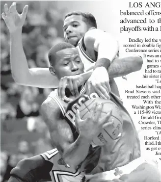  ?? ASSOCIATED PRESS ?? Boston Celtics guard Terry Rozier, front, gets a rebound against Chicago Bulls guard Michael Carter-Williams during the second half in Game 6 of an NBA basketball firstround playoff series in Chicago. The Celtics won 105-83.