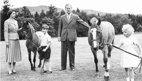  ?? ?? prince Charles and princess anne exercising their ponies under the watchful eyes of Queen elizabeth II and the duke of edinburgh during the royal family’s summer vacation at balmoral castle on aug 15, 1959.