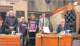  ?? SUBMITTED PHOTO ?? Steve Coombs (from left) of Wavey Elms Best, Grace Crane and Mike Wahl of the Purple Lights for John campaign attended Tuesday’s St. John’s City Council meeting where Mayor Danny Breen signed a proclamati­on declaring November as Pancreatic Cancer...