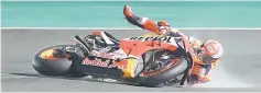  ??  ?? Repsol rider and current world champion Marc Marquez of Spain crashes in the fourth free practice session at Losail track near Doha. — AFP photo