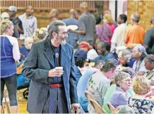  ?? [BARBARA J. PERENIC/DISPATCH] ?? Kent Beittel mingles with the crowd following a celebratio­n of the life of his wife, Mary Beittel, at Broad Street United Methodist Church. Hundreds attended the ceremony and the Open Shelter meal that followed on Aug. 28, 2017.