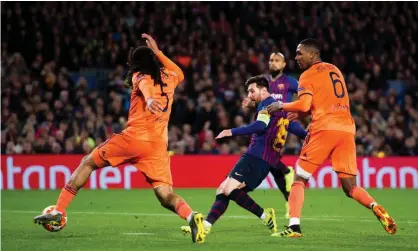  ??  ?? Lionel Messi converts Barcelona’s crucial third goal against a spirited Lyon. Photograph: Alex Caparros/Uefa via Getty Images