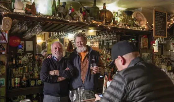  ?? TONY CENICOLA, NEW YORK TIMES ?? Martin Sheridan, left, and Richard Hayman, owners of 1770 Ear Inn, have encountere­d all kinds of artifacts while shoring up the building in Lower Manhattan.