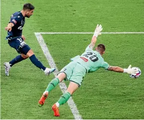  ?? GETTY ?? Bruno Fornaroli gets past Oliver Sail to start Melbourne Victory’s 3-1 comeback win over the Phoenix on February 3.